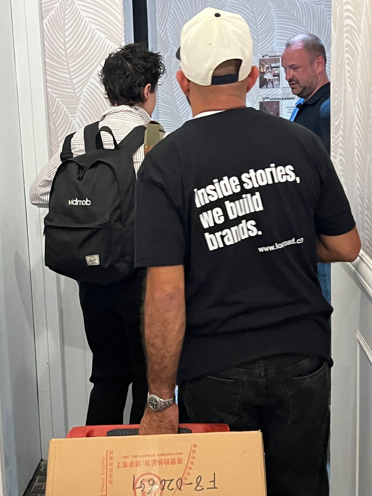 Longo Advertising crew in branded shirts during load in for the AMEX Live Lounge build