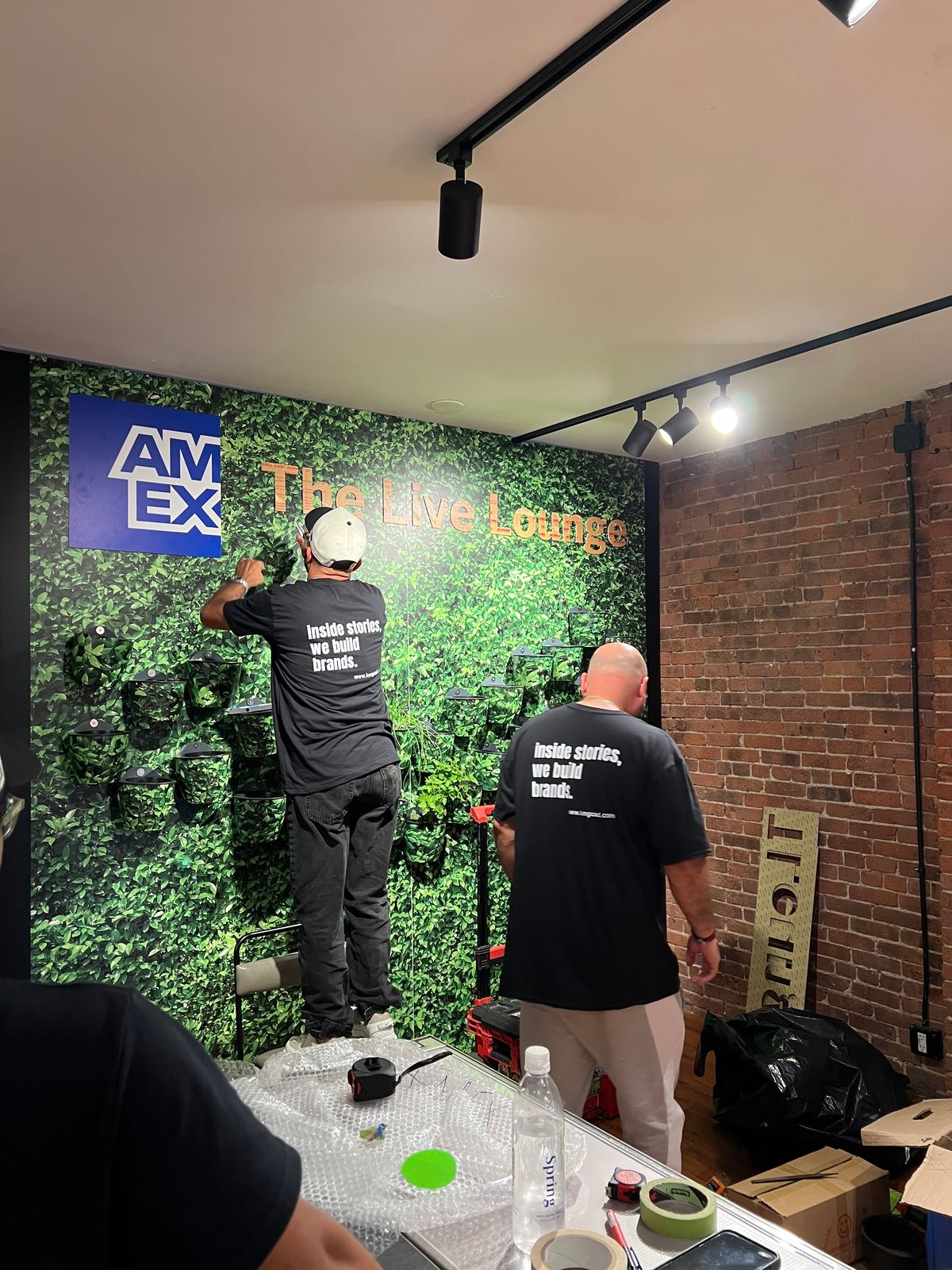 Longo Advertising team installing the living wall plants at the AMEX Live Lounge